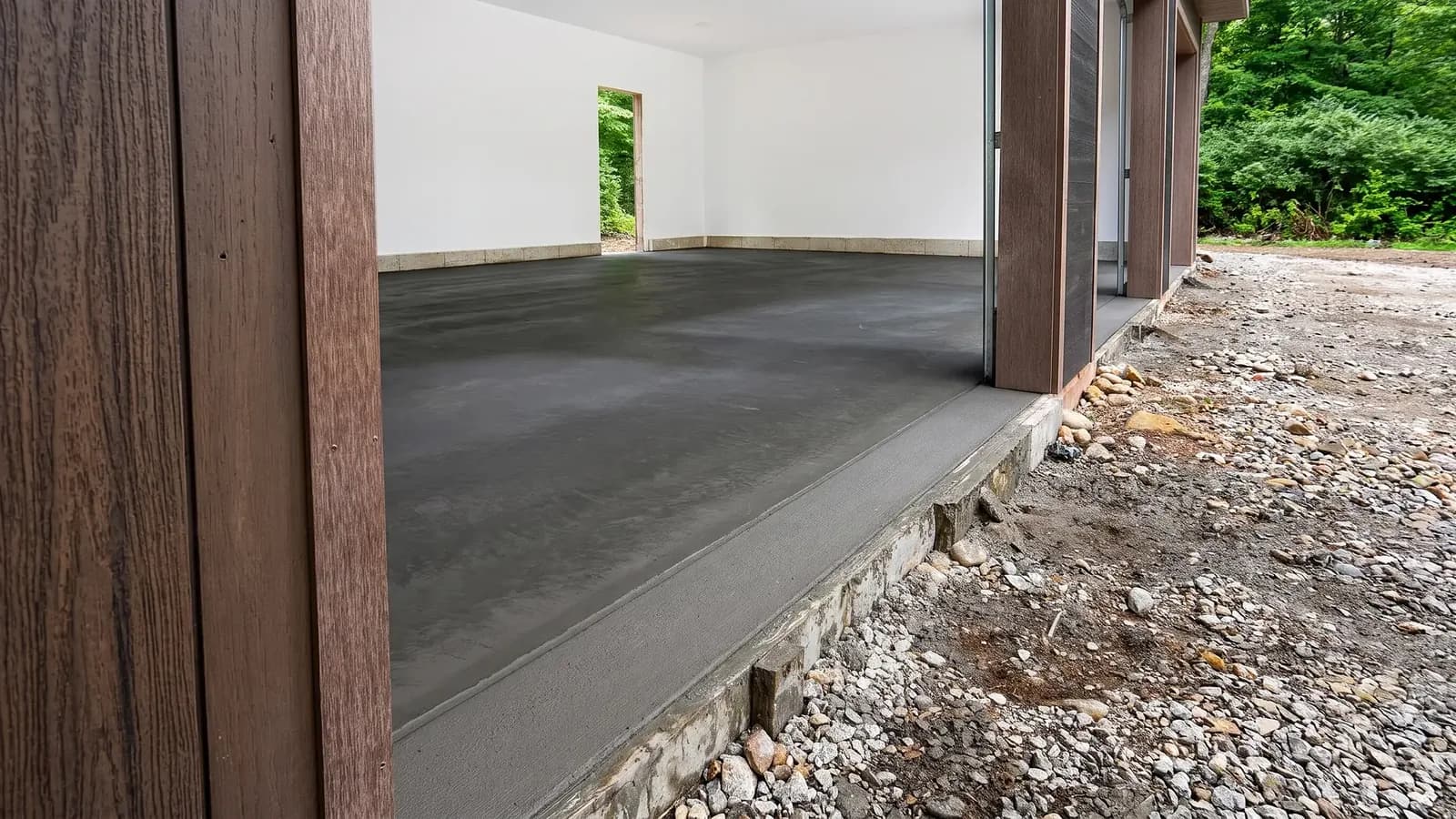Fresh concrete garage threshold with a clean finished edge