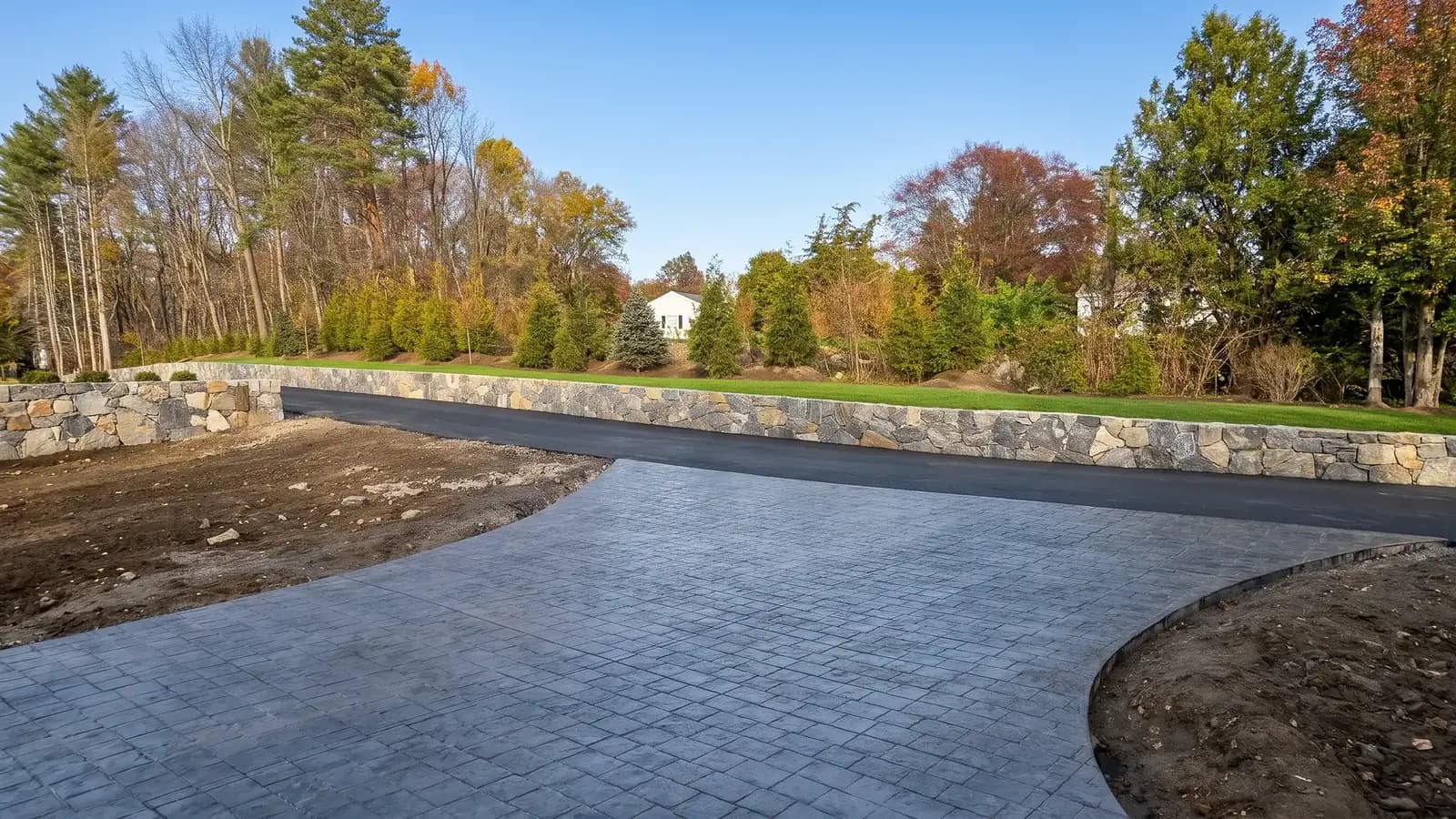 New stamped concrete driveway installation in progress at a Marlborough, MA home