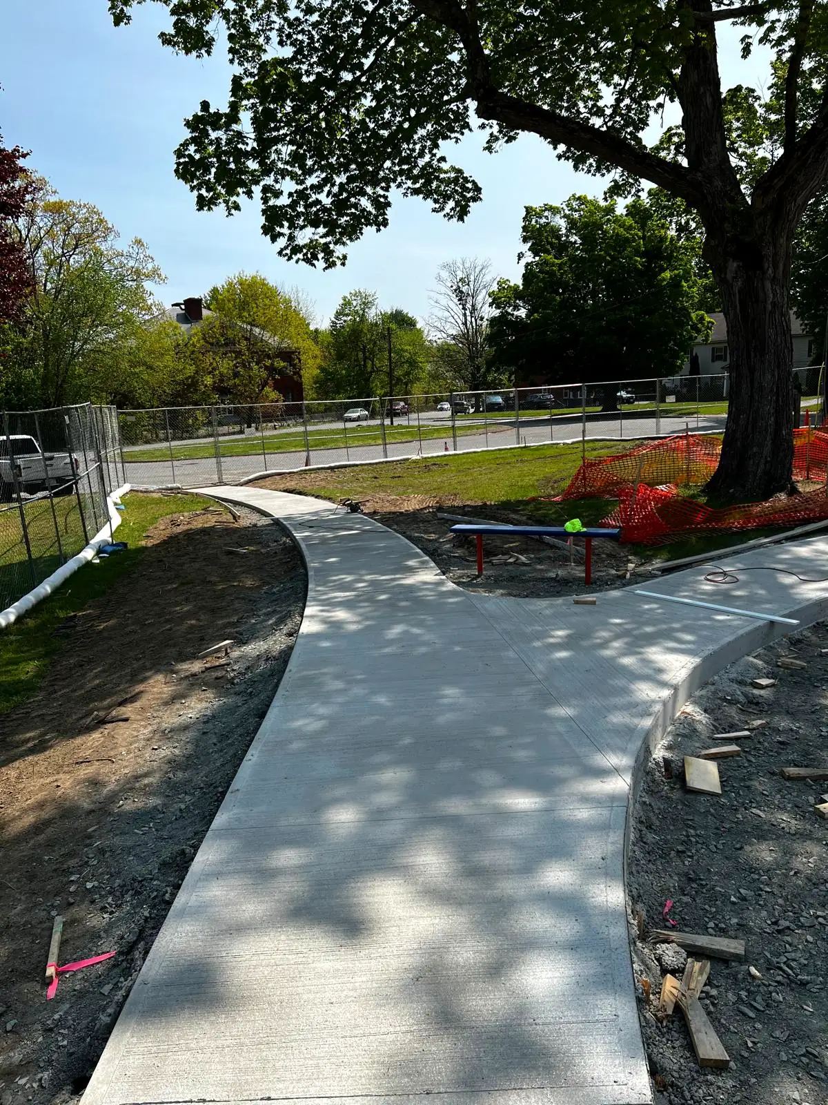 Newly poured concrete walkway path installed outside a Natick, MA home